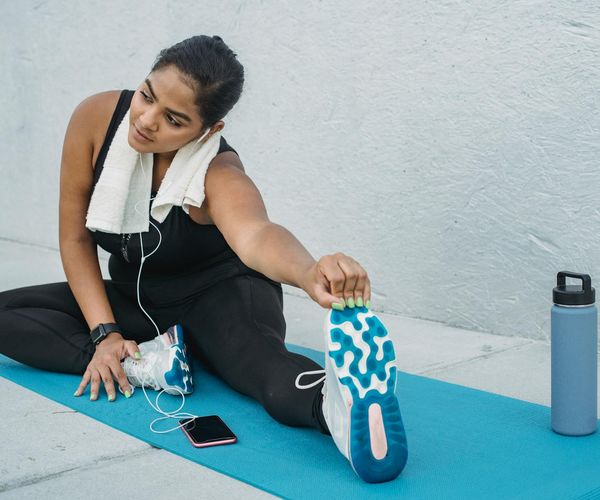 Neatly folded yoga mat, a water bottle, and a small towel.